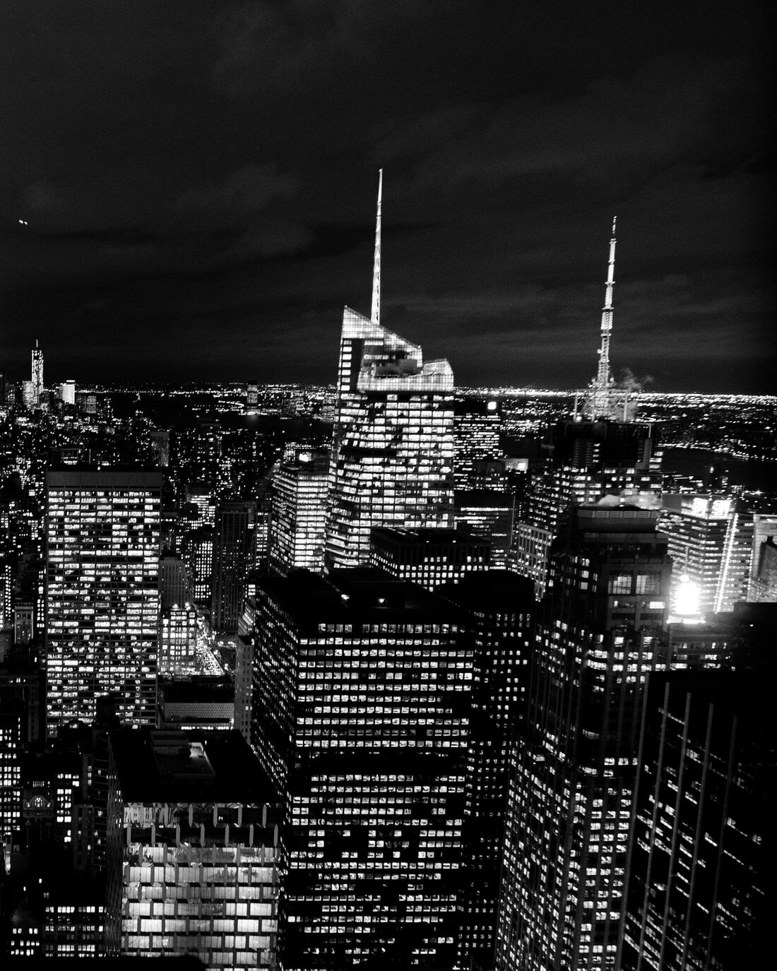 A city skyline at night seen from above